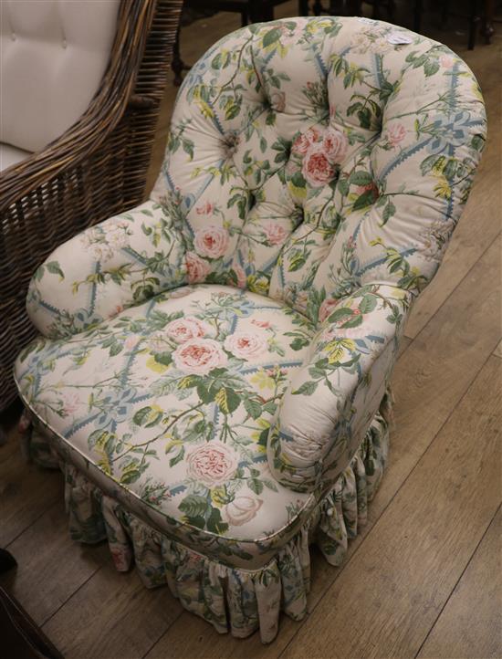 A late Victorian nursing chair with floral loose covers